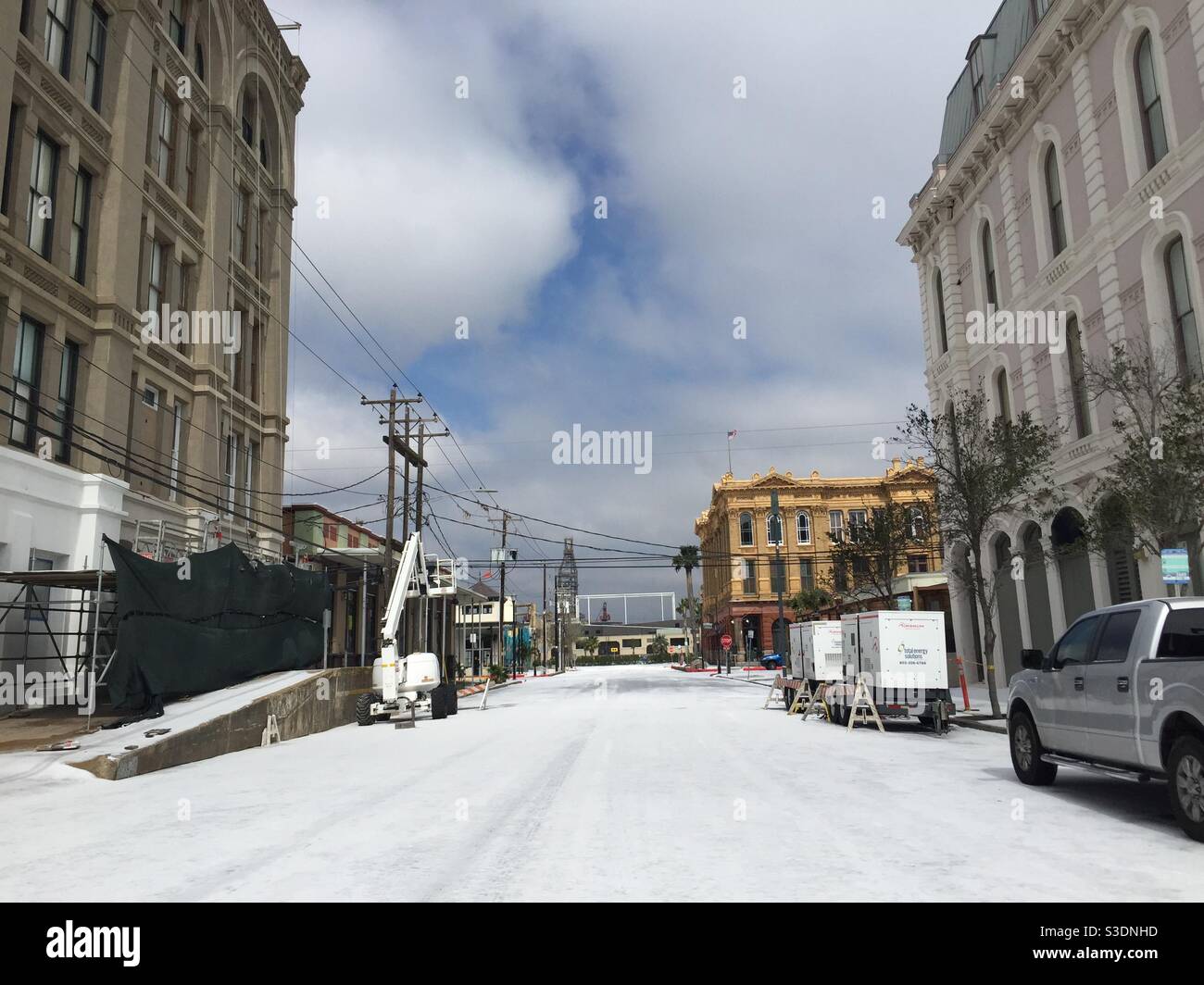 Snow in Galveston, February 25, 2021. 24th Street between The Strand and Mechanic Street looking towards the harbor. Last time it snowed in Galveston was 2004 and before that, 1895. - Smartphone Captured Stock Image