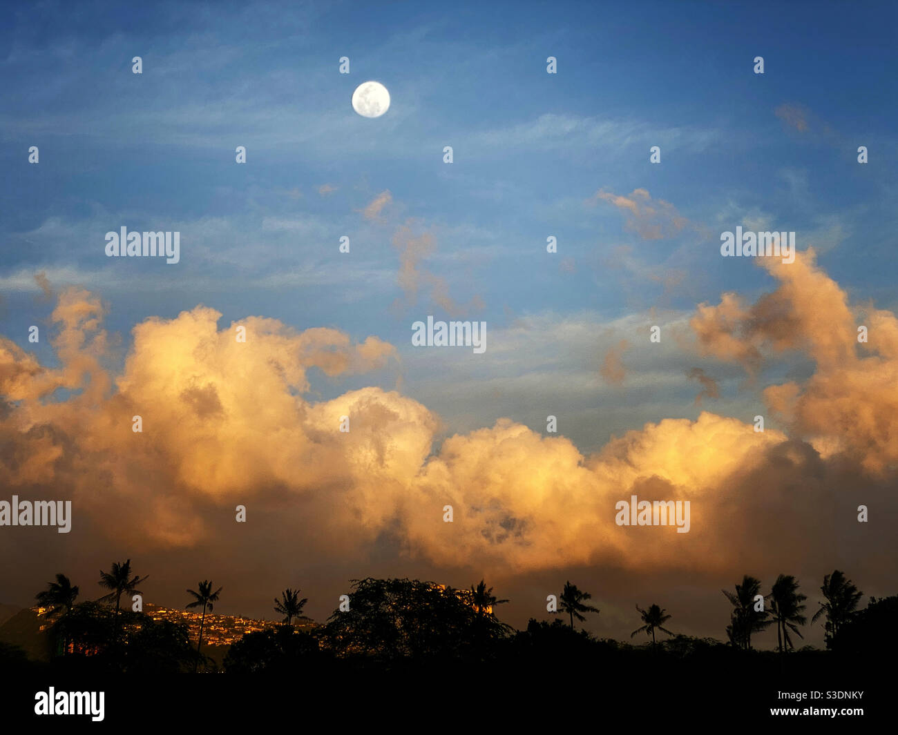 Moon over a Honolulu landscape at sunset - Smartphone Captured Stock Image