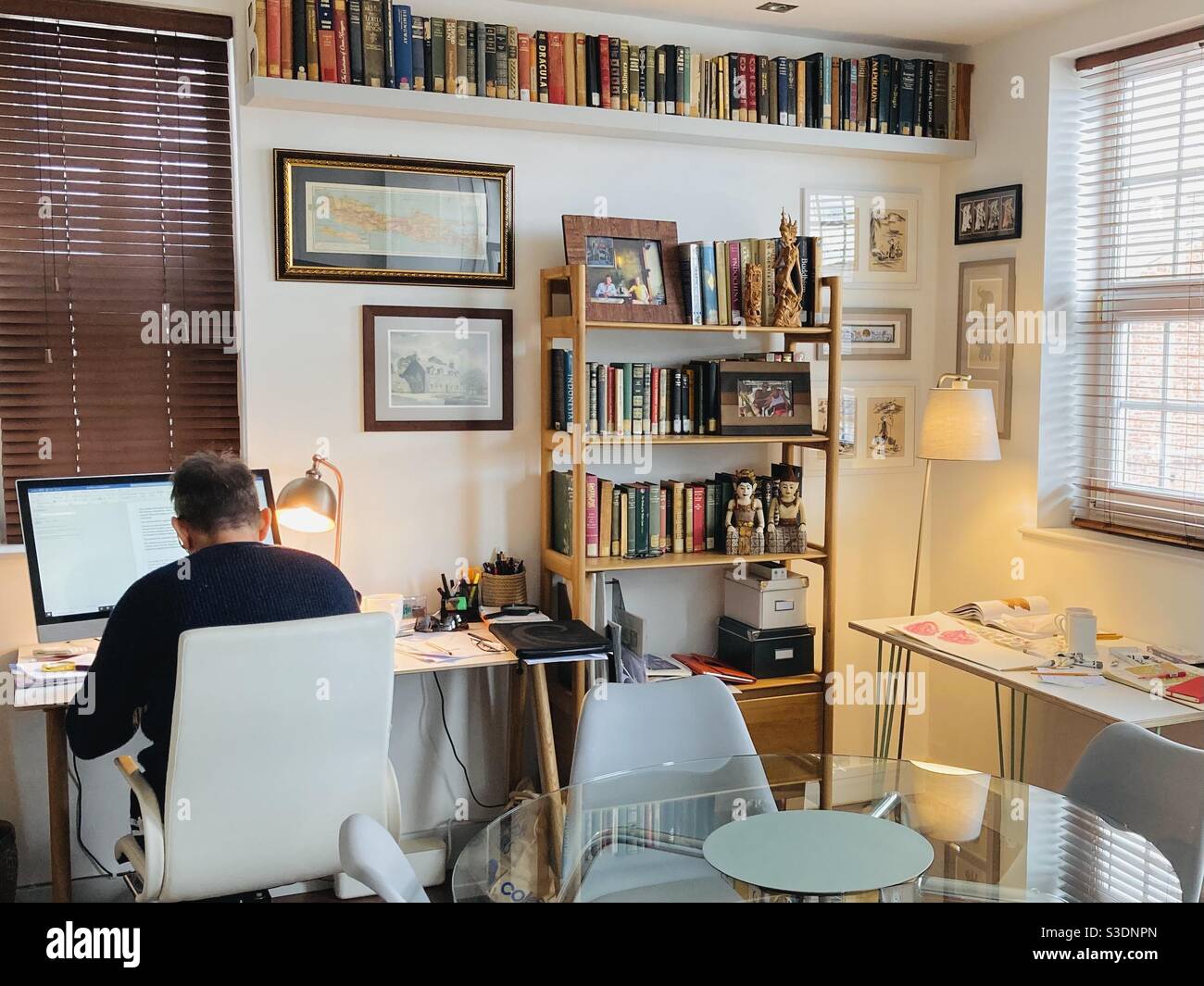 Working from home with desks and bookshelves Stock Photo Alamy