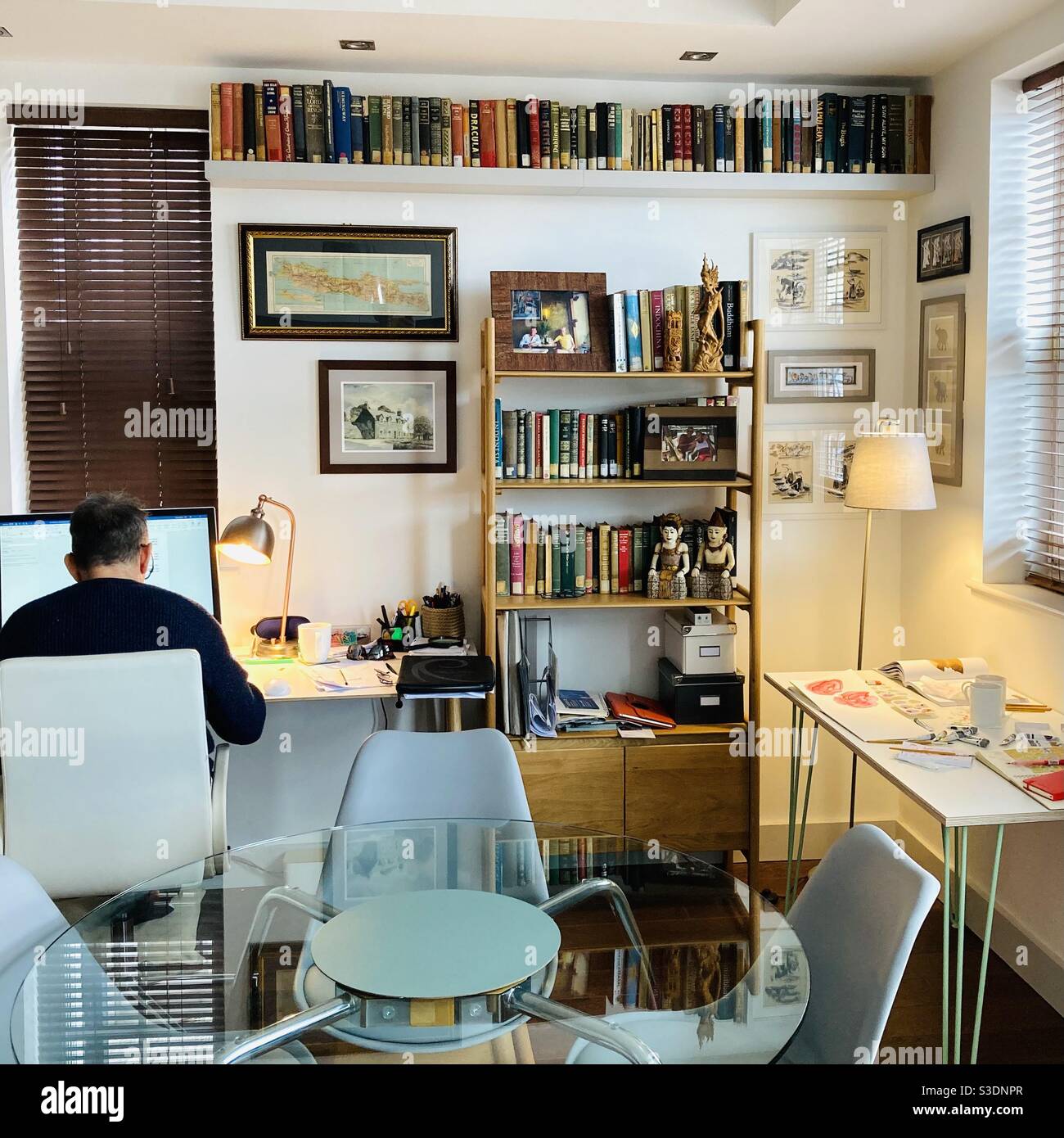 Working from home desks and bookshelves - Smartphone Captured Stock Image
