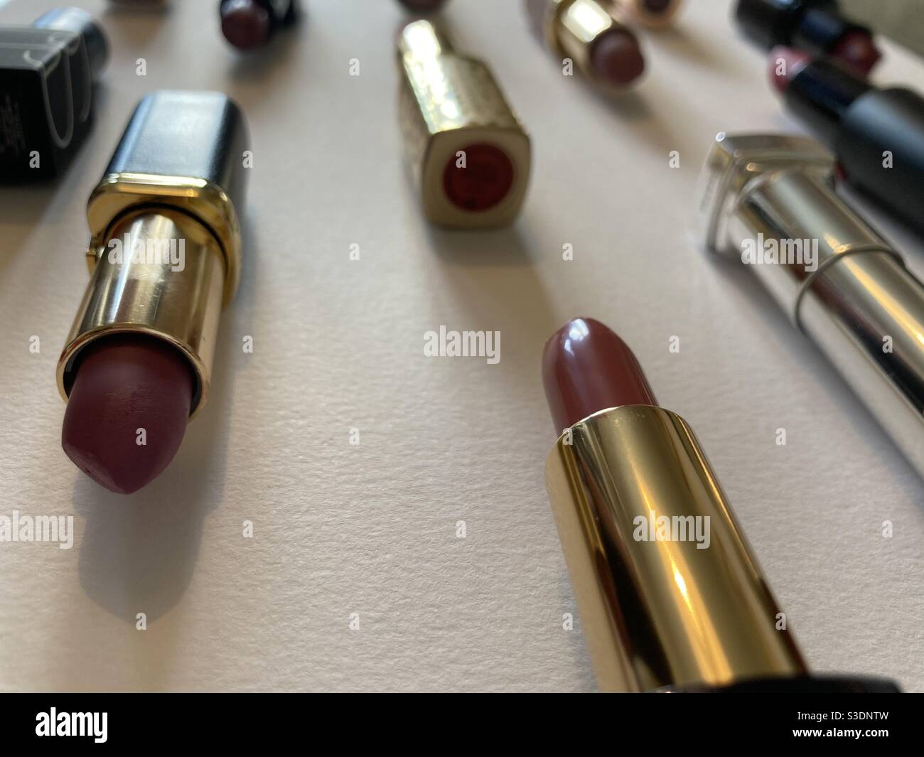 Lipsticks arranged in rows Stock Photo