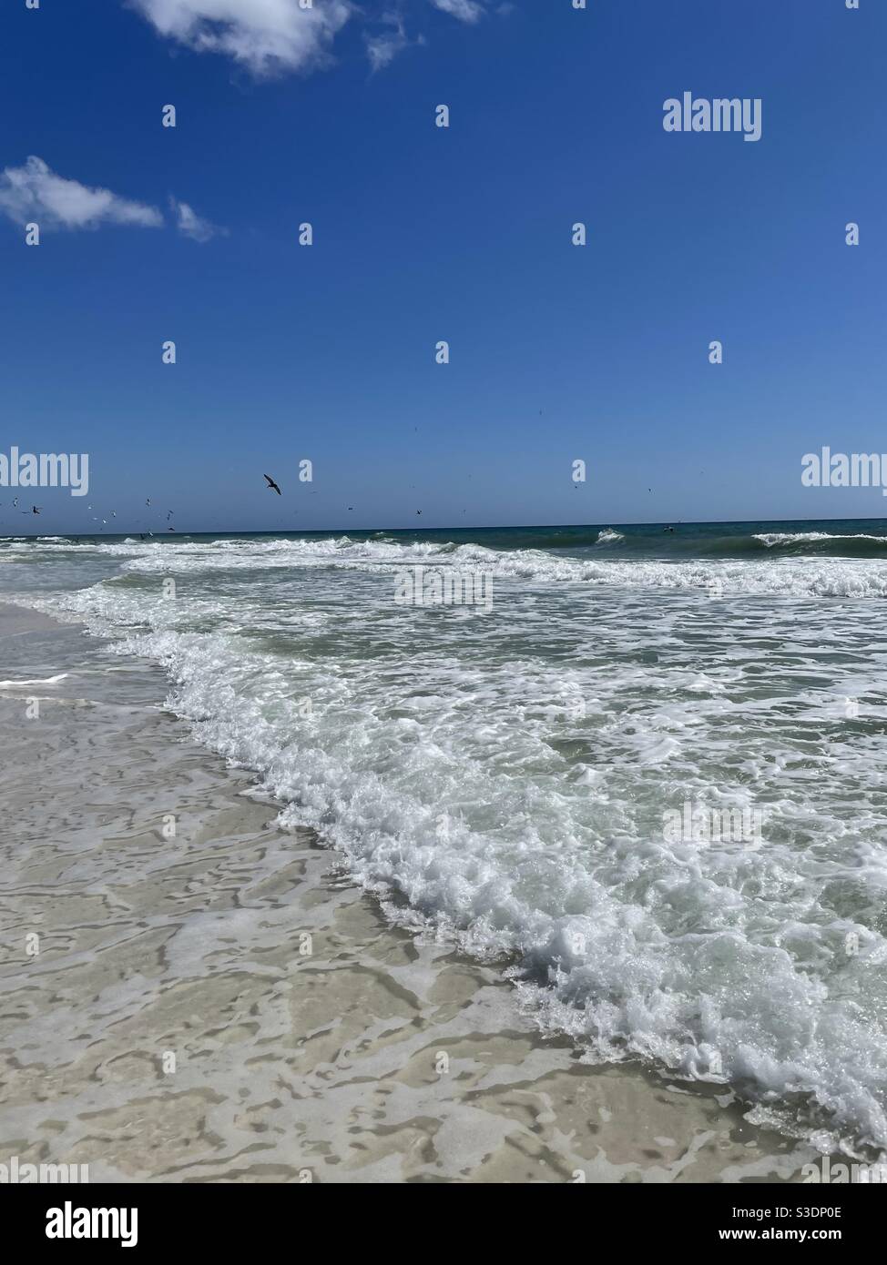 Ocean waves on the emerald colored water of the Gulf of Mexico Florida - Smartphone Captured Stock Image
