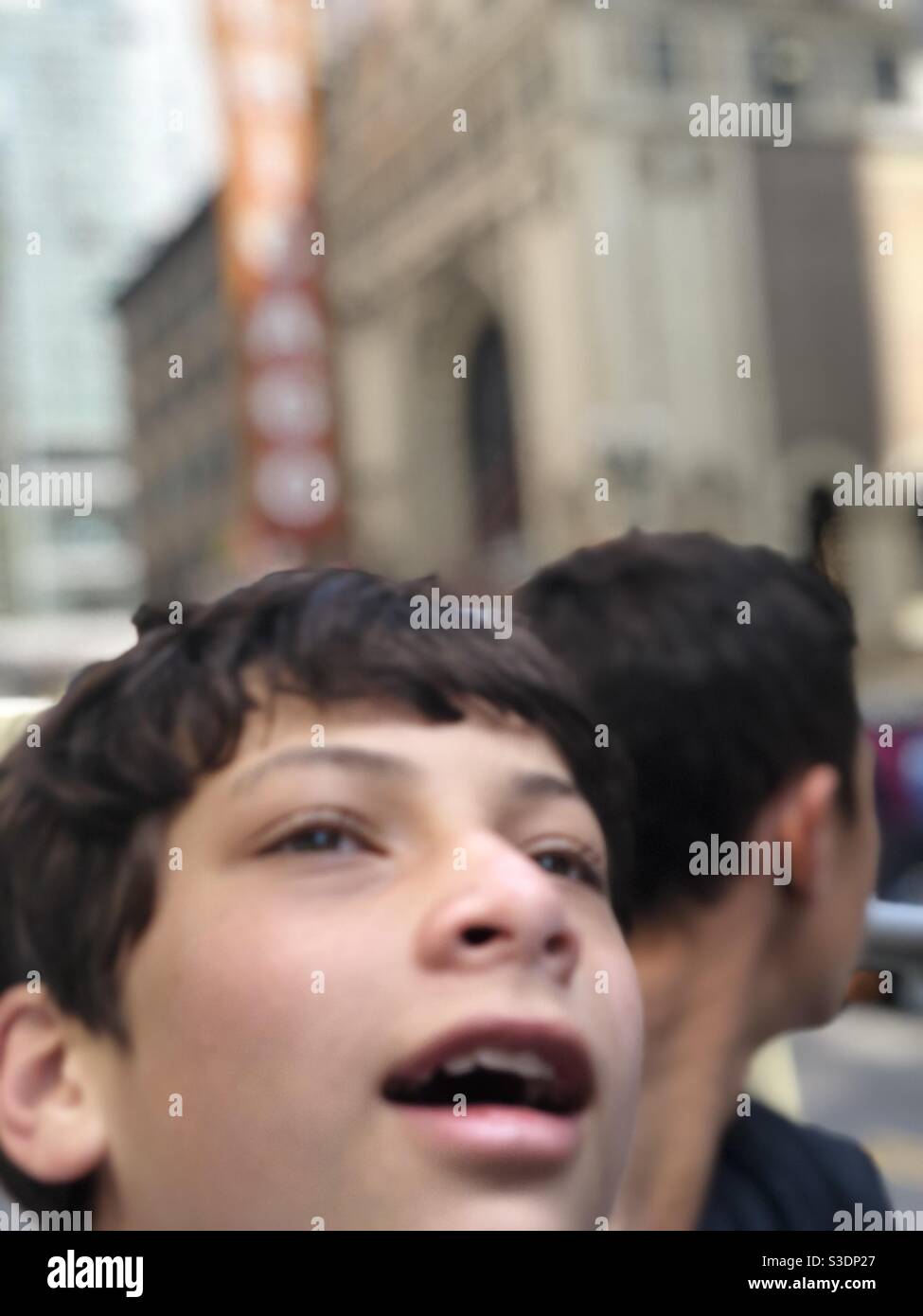 Boy looking up in awe Stock Photo