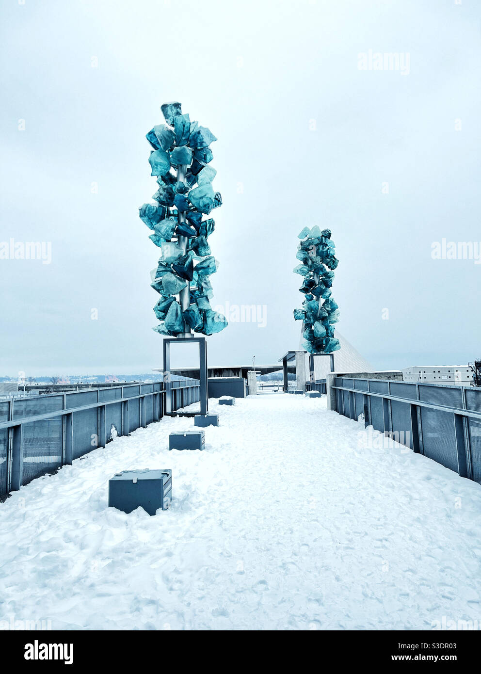 Crystal towers by Dale Chihuly on a Glass Bridge in Tacoma, WA, during rare snow day Stock Photo