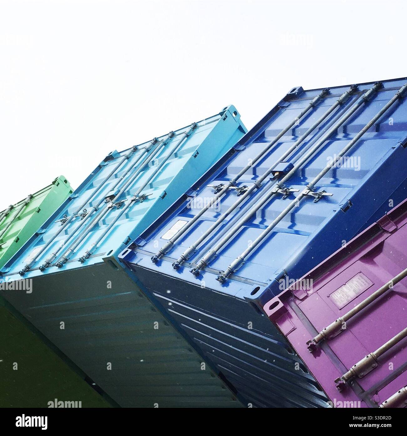 Rainbow made out of shipping containers. Blue shades Stock Photo