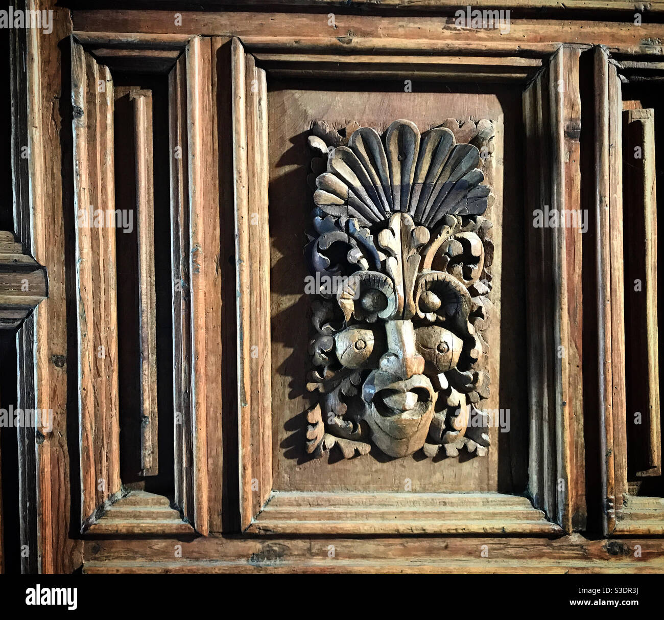 An indigenous figure decorates a door in the church of Araro, Michoacan, Mexico Stock Photo