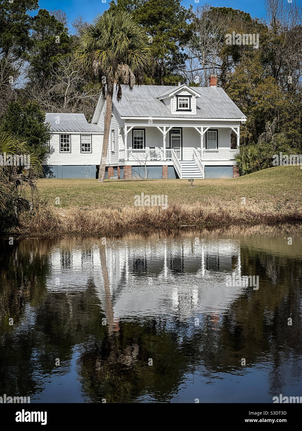 Bloody Point Front Range Lighthouse reflecting in a nearby pond, Daufuskie Island, South Carolina. - Smartphone Captured Stock Image
