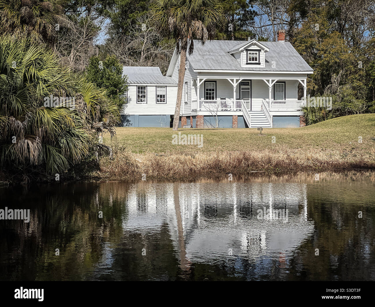 Bloody Point Front Range Lighthouse reflecting in a beer by pond, Daufuskie Island, South Carolina. - Smartphone Captured Stock Image