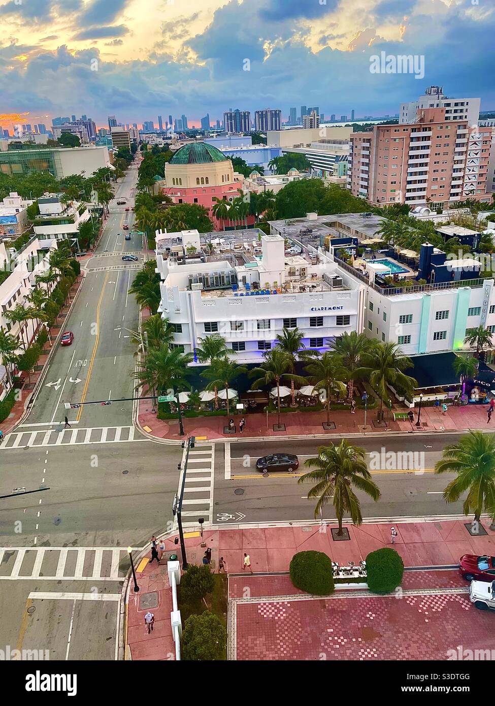 A sunset view overlooking the intersection of popular Collins Street and 17th Ave. in Miami South Beach, Florida, USA 33139; the Hampton in Claremont Hotel and the Dorsett Hotel Stock Photo