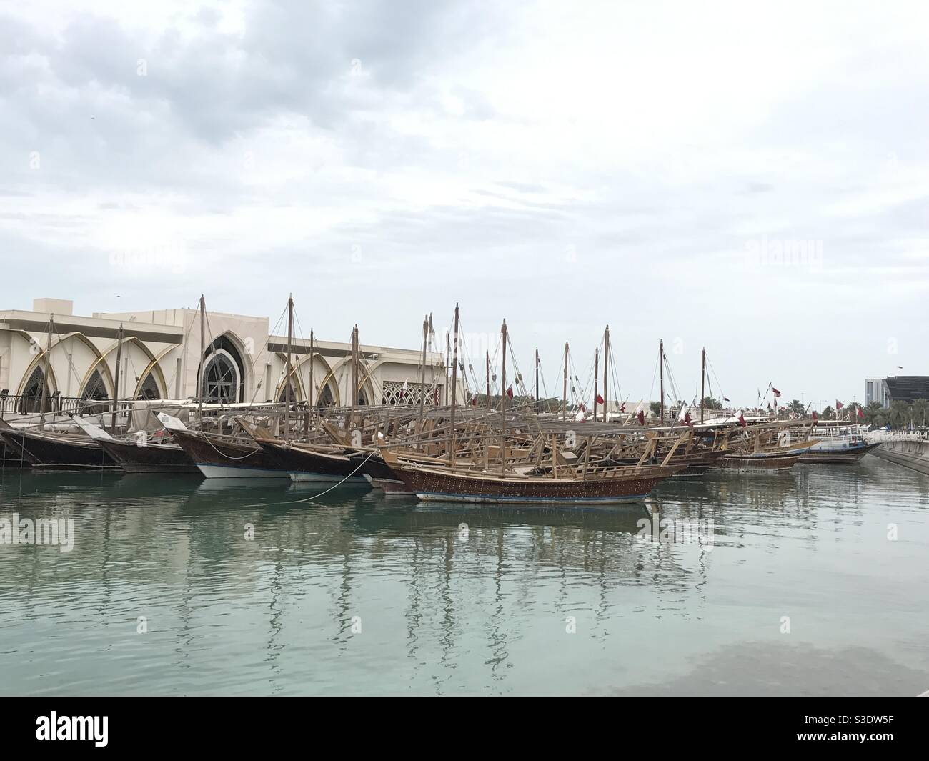 Closeup image of traditional dhow boats along the Doha Corniche in Qatar - Smartphone Captured Stock Image