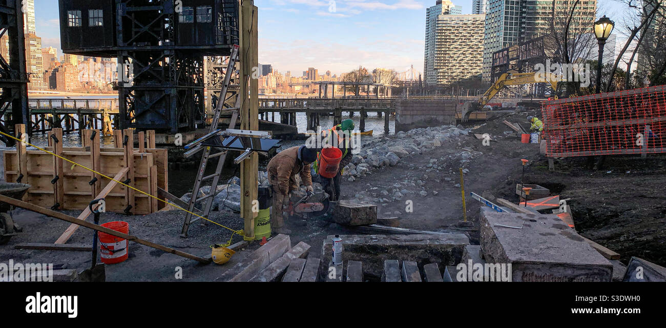 Men at work at the Gantry Plaza State park on the LIC waterfront - Smartphone Captured Stock Image