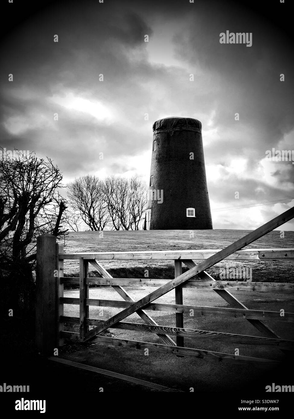 Old windmill with no sails in black and white - Smartphone Captured Stock Image