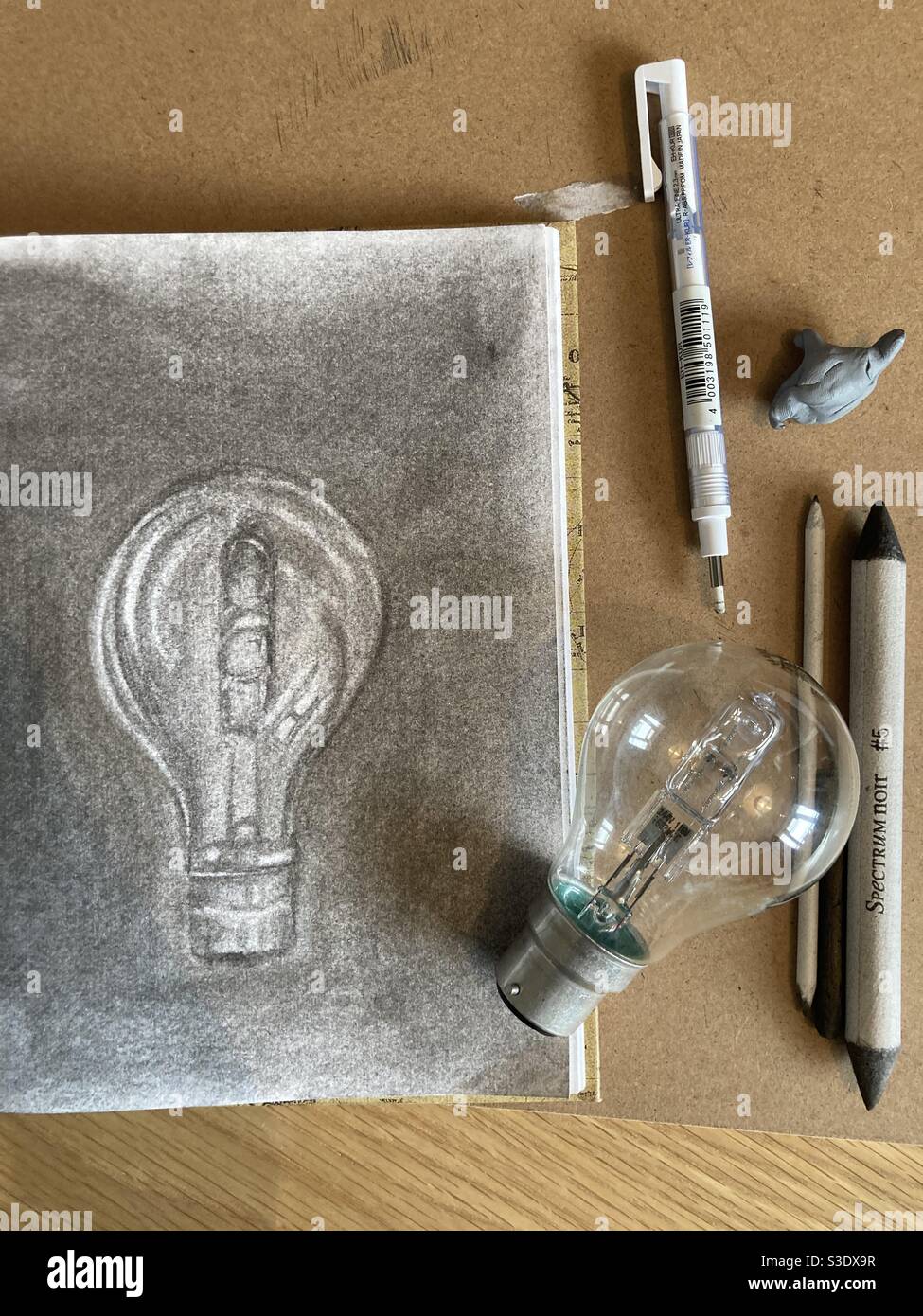 A sketch of a light bulb in charcoal Stock Photo