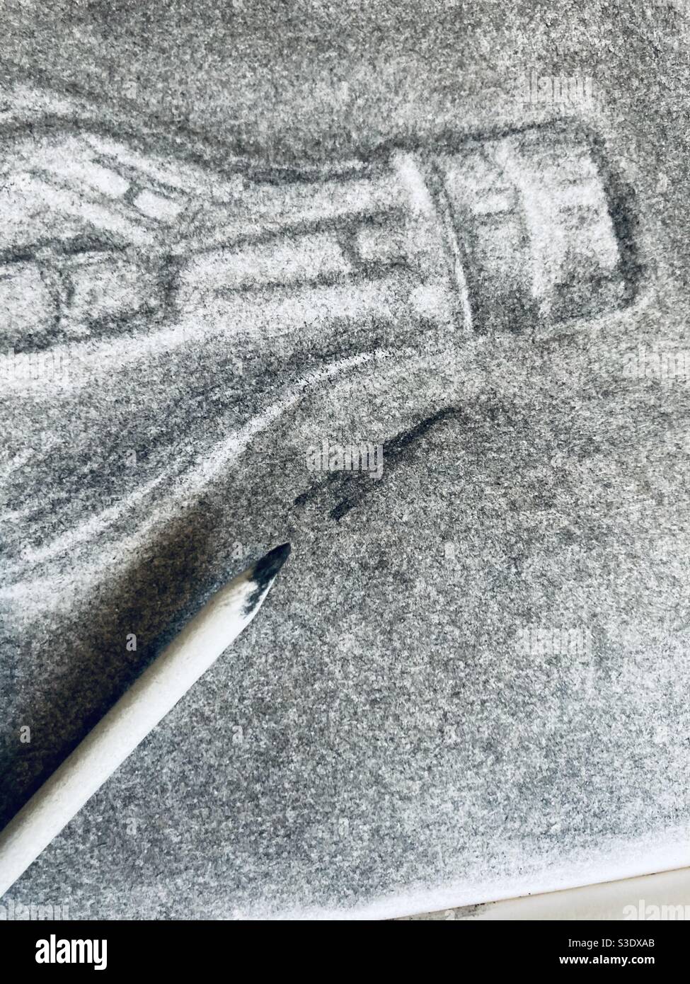 Using charcoal and blender to add tone and shade to a drawing Stock