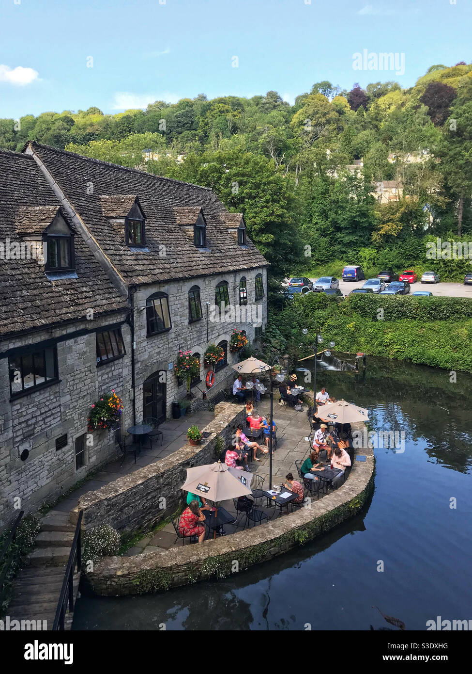 The waterside patio at the Egypt Mill Hotel and Restaurant, Nailsworth, near Stroud, Gloucestershire, England. Stock Photo