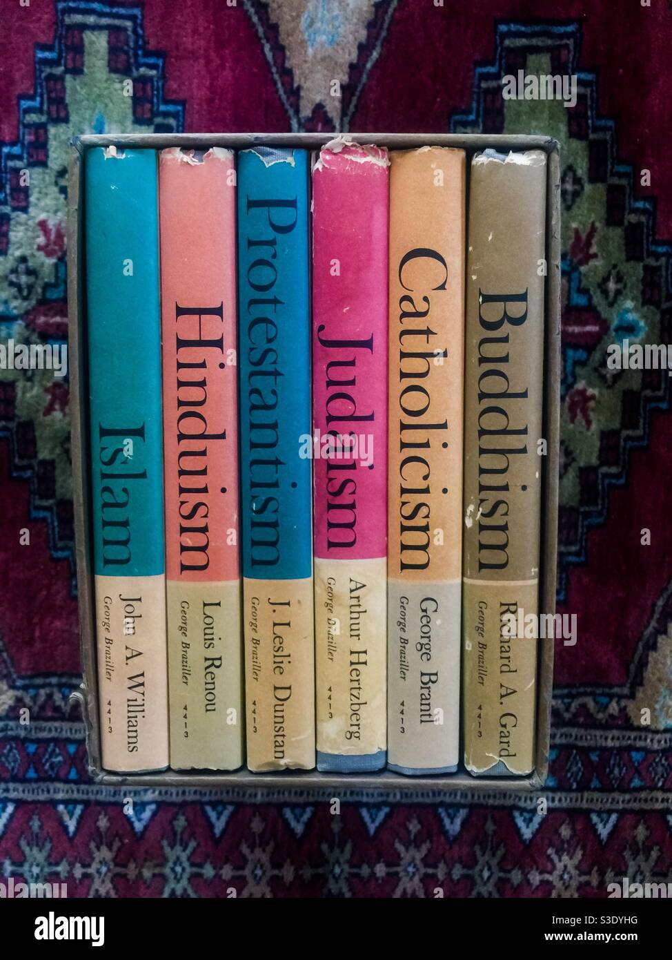 Major religions in one box set. Six books, on Hinduism, Islam, Buddhism, Catholicism, Judaism, and Protestantism. Concept of harmony, syncretism, faith, coexistence, peace, diversity, unity. Stock Photo