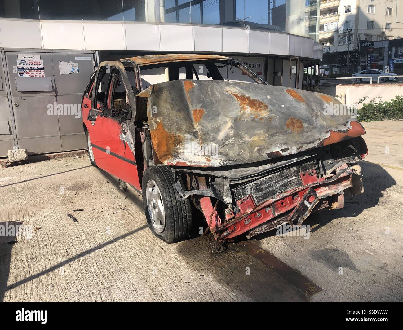 Wrecked automobile left on street - Smartphone Captured Stock Image
