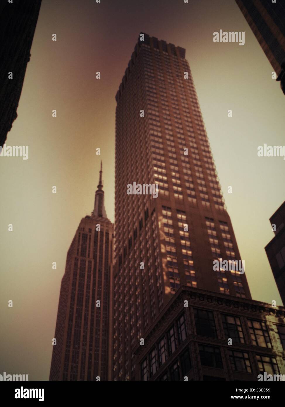 The Langham Hotel in the empire state building shot from below on fifth Avenue in Midtown Manhattan, NYC, USA - Smartphone Captured Stock Image