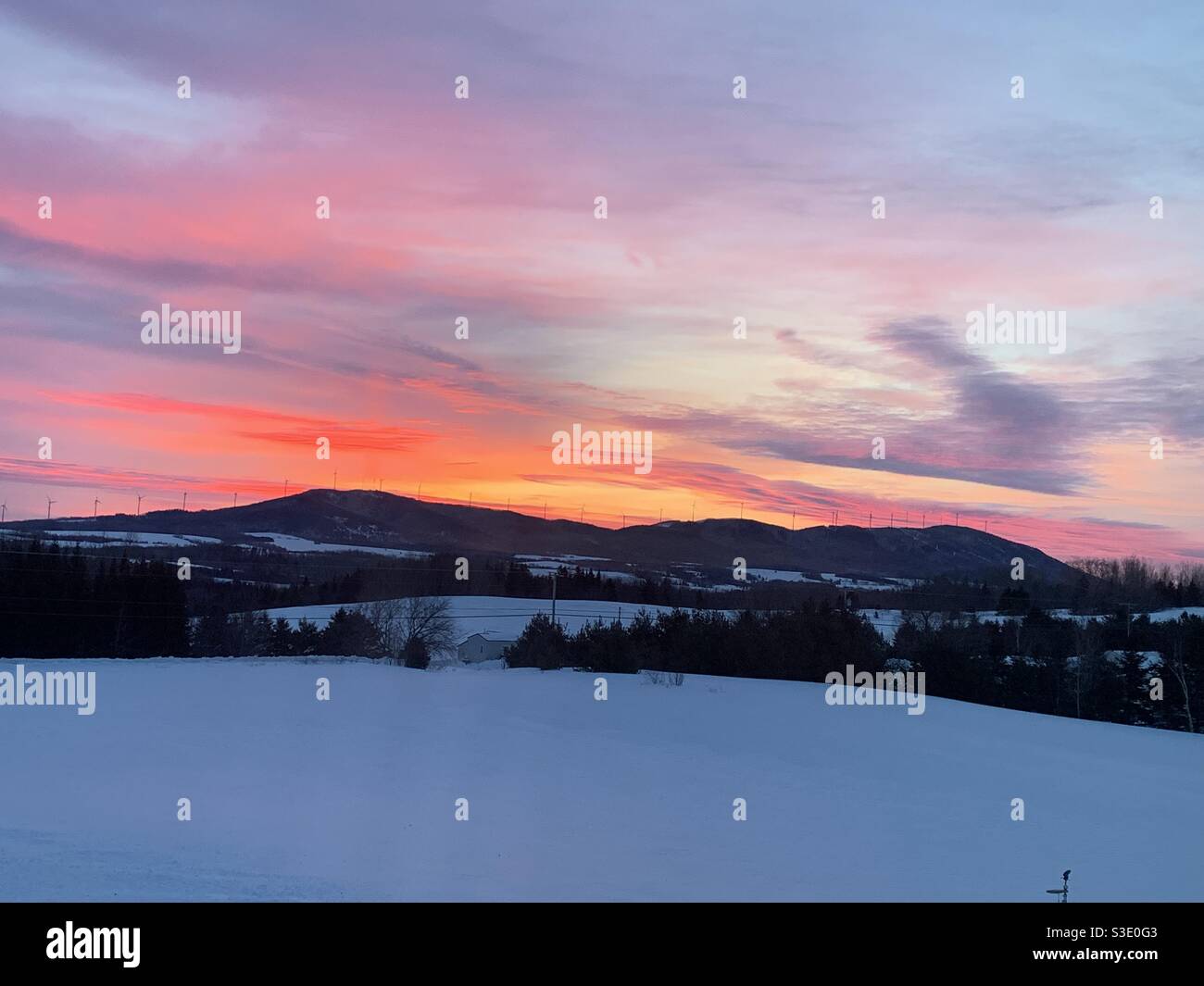 Snowscape sunrise over Mars Hill northern Maine USA in Winter, January 23, 2019 at 7:54 am. Stock Photo