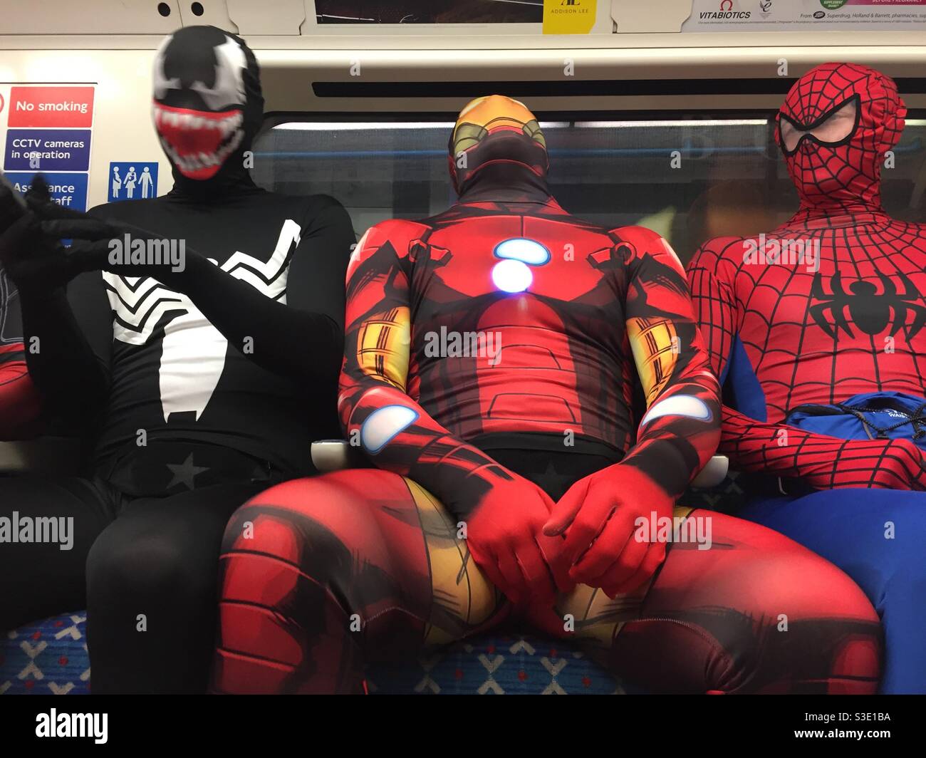 Guys in fancy dress on the tube - Smartphone Captured Stock Image