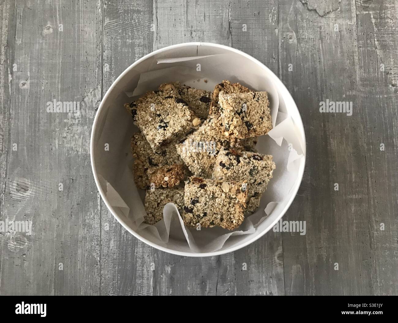 Closeup image of homemade breakfast cereal bars in a tin Stock Photo