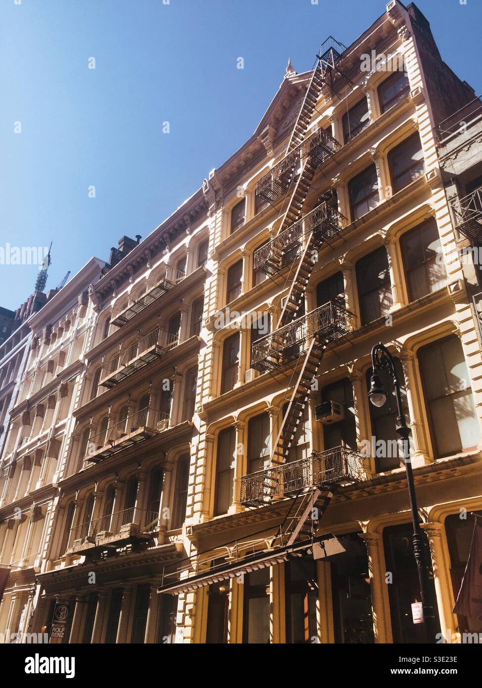 Cast-iron façades of buildings in the historical district of Soho, NYC, USA - Smartphone Captured Stock Image