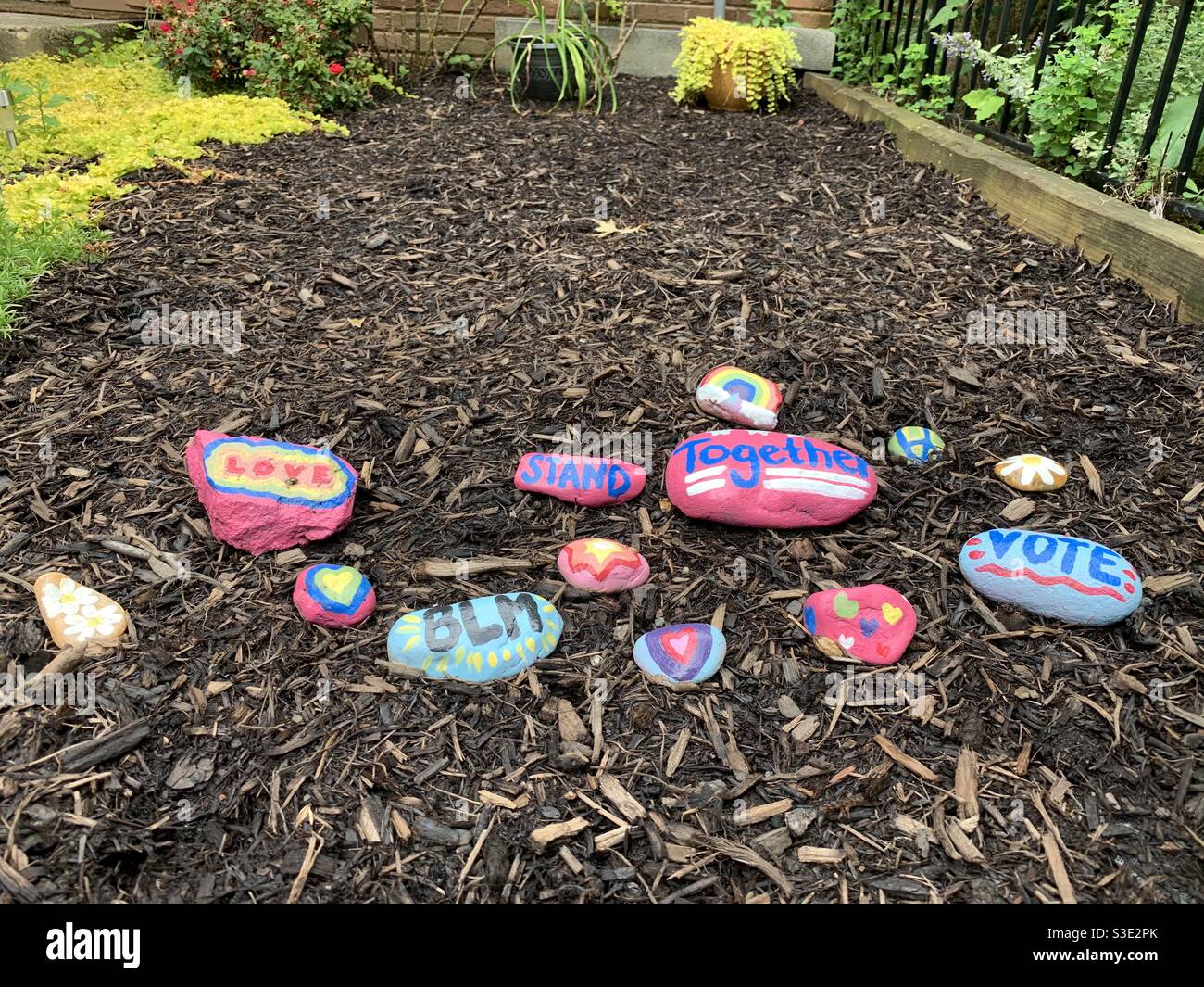 Rocks painted with encouraging messages Stock Photo