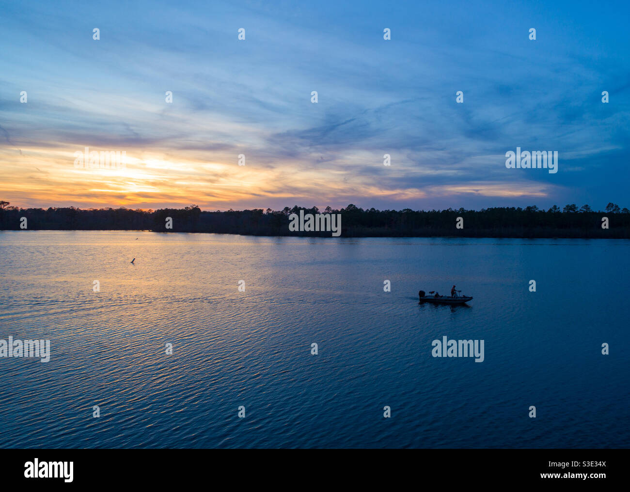 Lone boat on Big Creek Lake at sunset Stock Photo Alamy