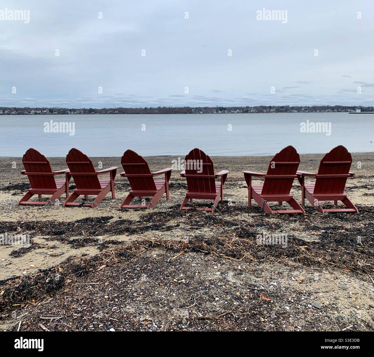 December, 2020, Adirondack chairs on the water, Salem, Massachusetts, United States - Smartphone Captured Stock Image