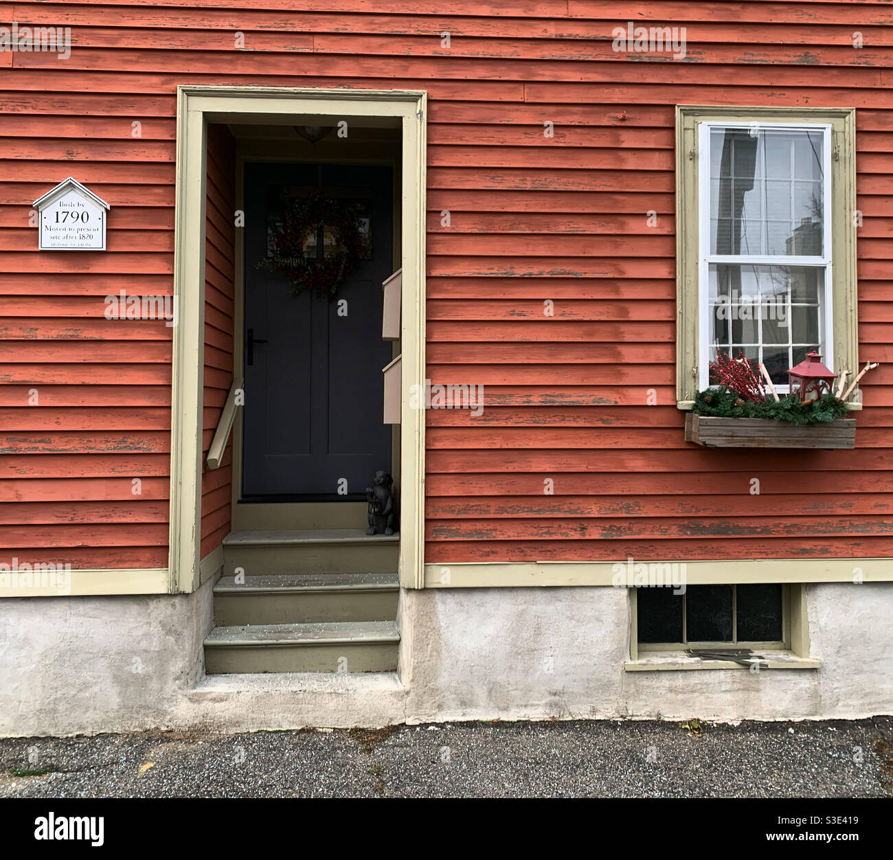 Entrance to a building with a small sign to the left of the door reading “Built by 1790. Moved to present site after 1820. Historic Salem Inc.” Salem, Massachusetts, United States - Smartphone Captured Stock Image
