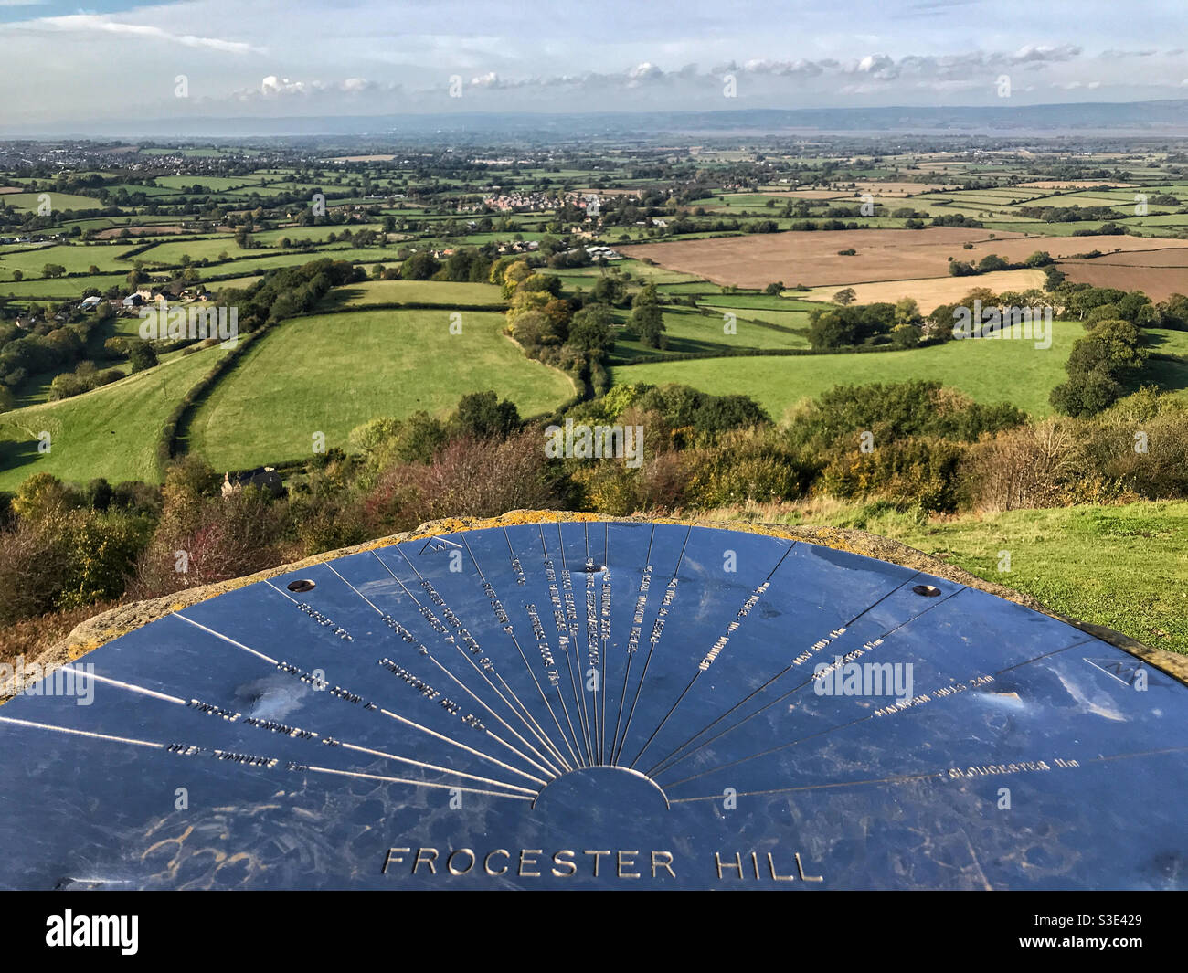 Frocester Hill topograph and view across the Severn Vale countryside. Looking towards the River Severn and Wales in the far distance. From Coaley Peak in the Cotswolds, near Stroud, Gloucestershire. - Smartphone Captured Stock Image
