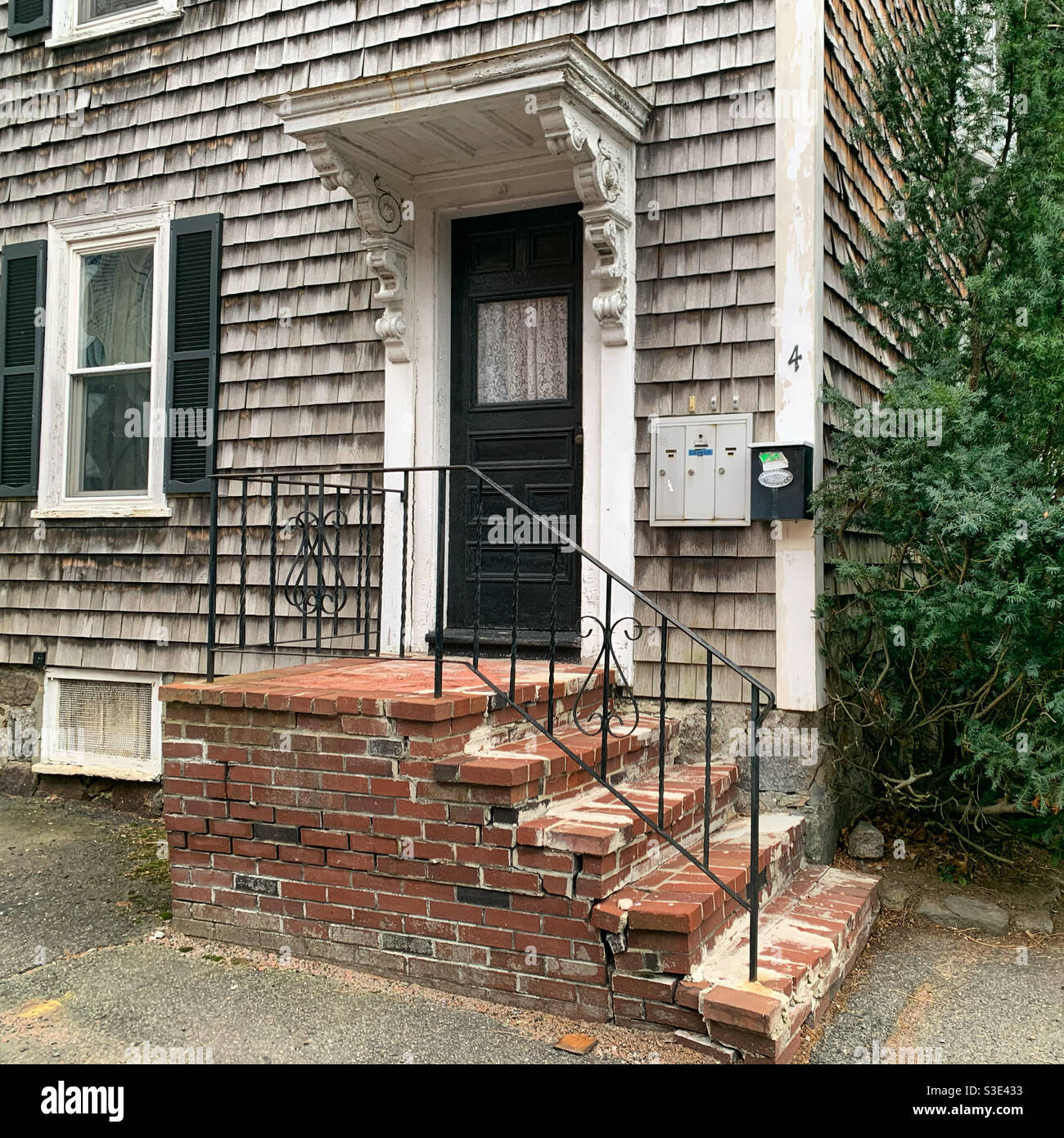 Door to a shingled building in Salem, Massachusetts, United States - Smartphone Captured Stock Image