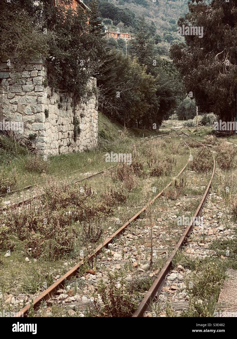 Railroad of an old and dismissed train station in a rural town. Stock Photo