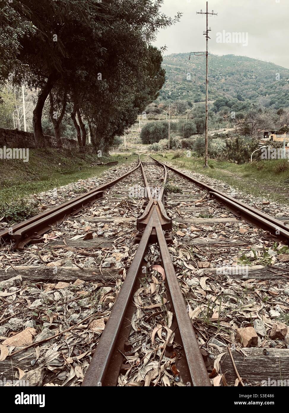 Railroad of an old and dismissed train station in a rural town. Stock Photo