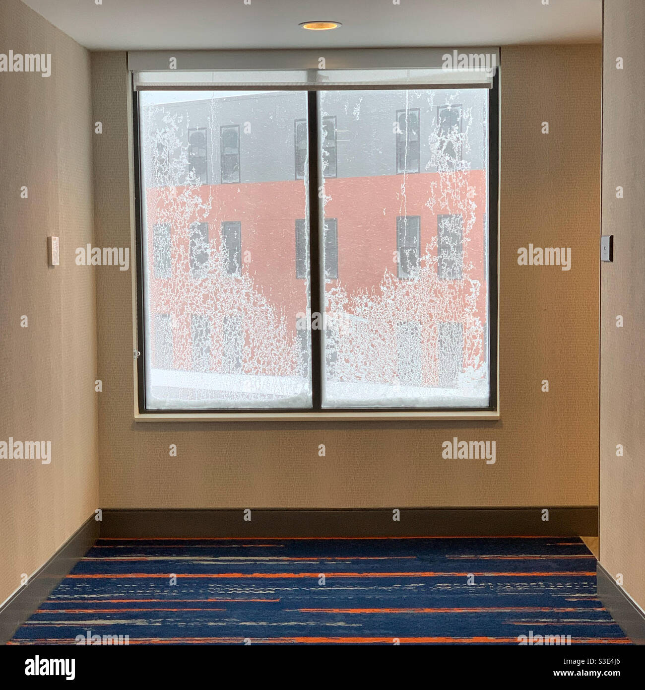 December, 2020, icy window in a hotel hallway, Massachusetts, United States - Smartphone Captured Stock Image