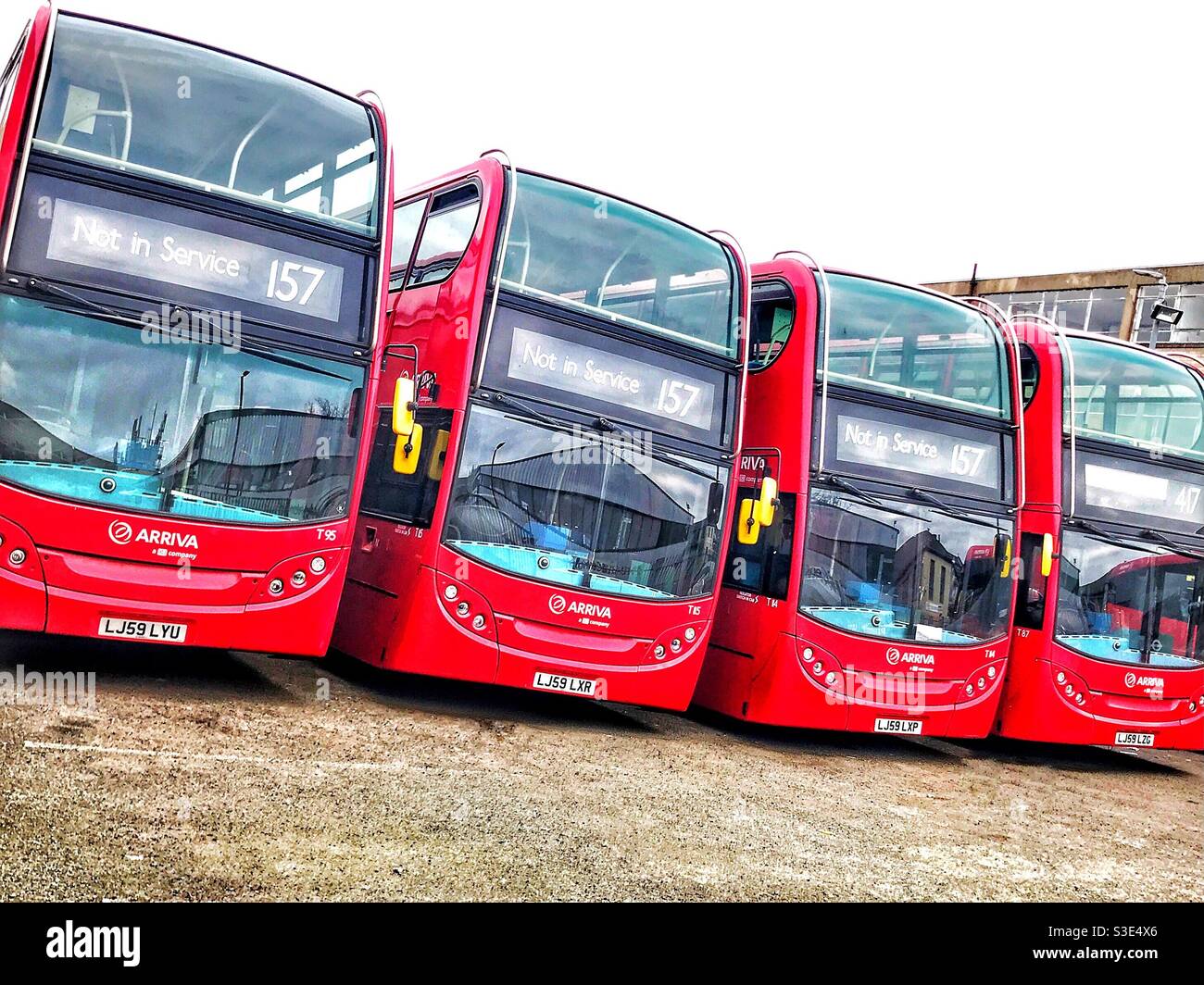 A row of red London buses Stock Photo Alamy