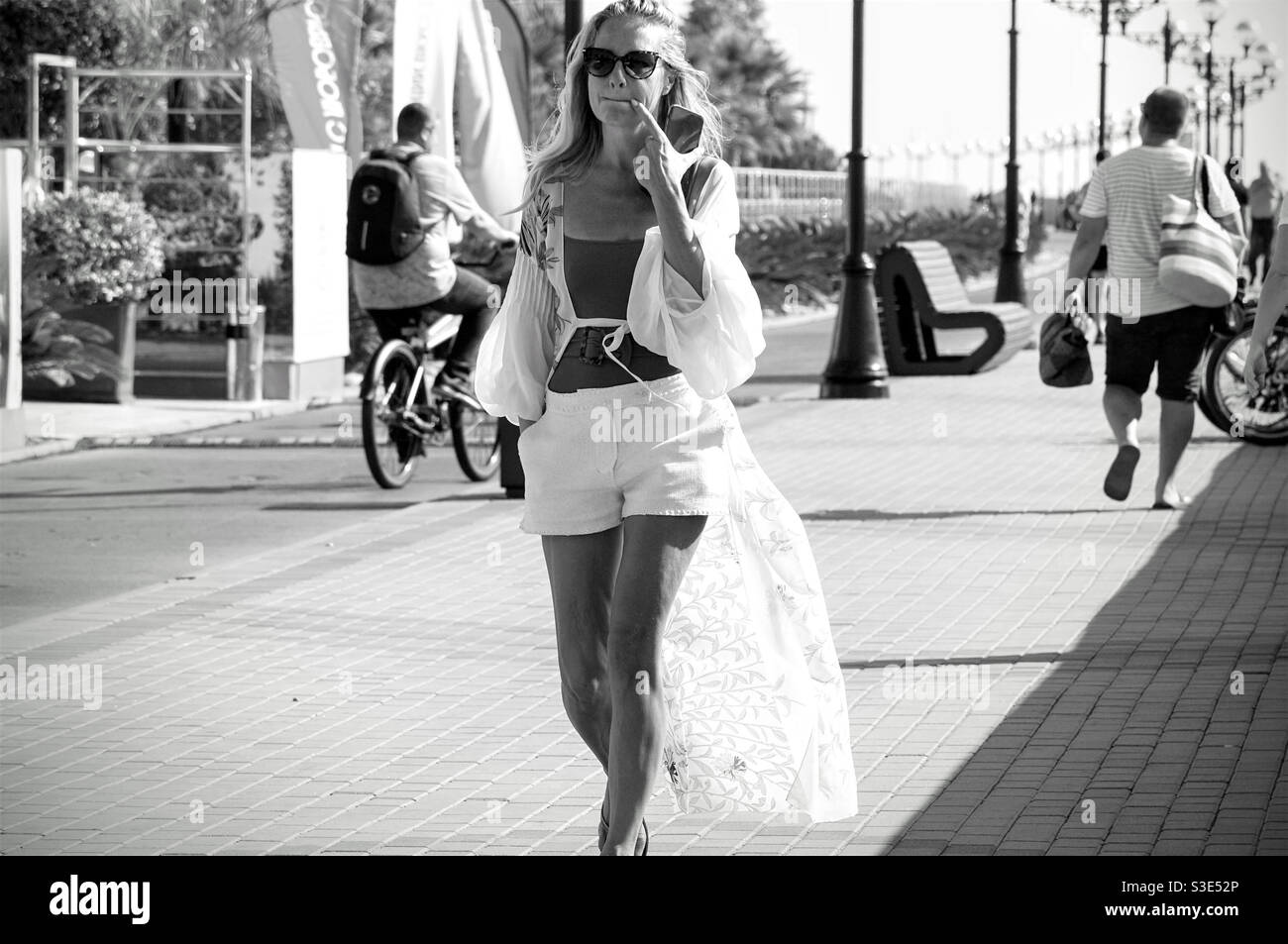 Young woman walks path in hi-res stock photography and images - Alamy