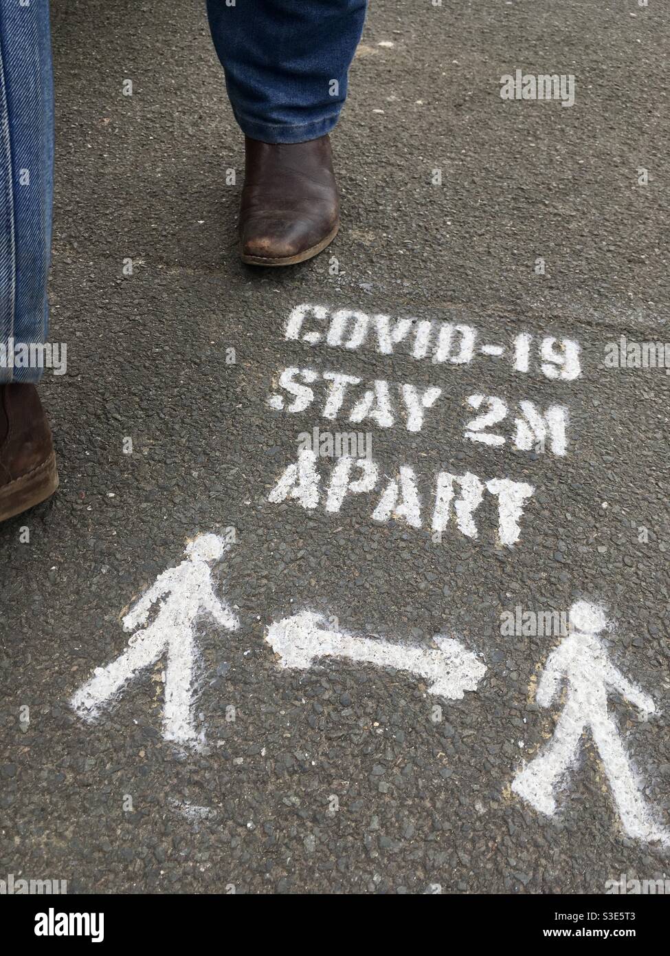 Covid Roadmap Pavement Sign - Smartphone Captured Stock Image