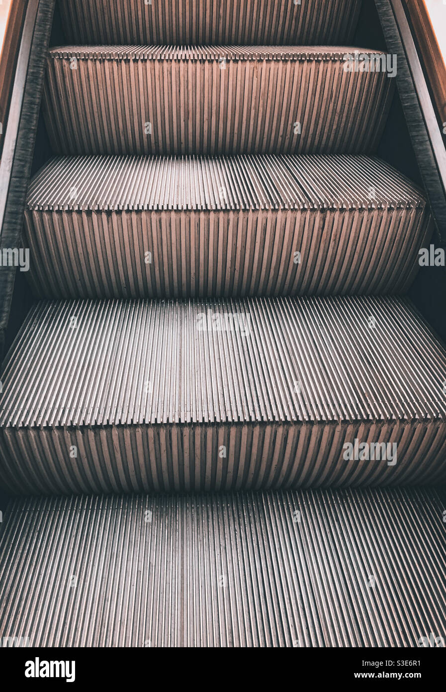 Going up an escalator in a shop. - Smartphone Captured Stock Image