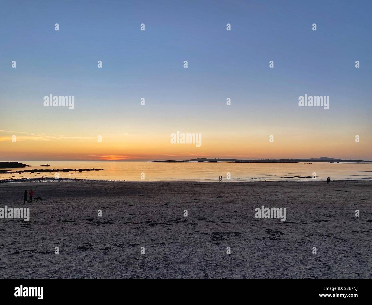 Sunset on Rhosneigr beach, Anglesey, north wales, UK, March evening - Smartphone Captured Stock Image