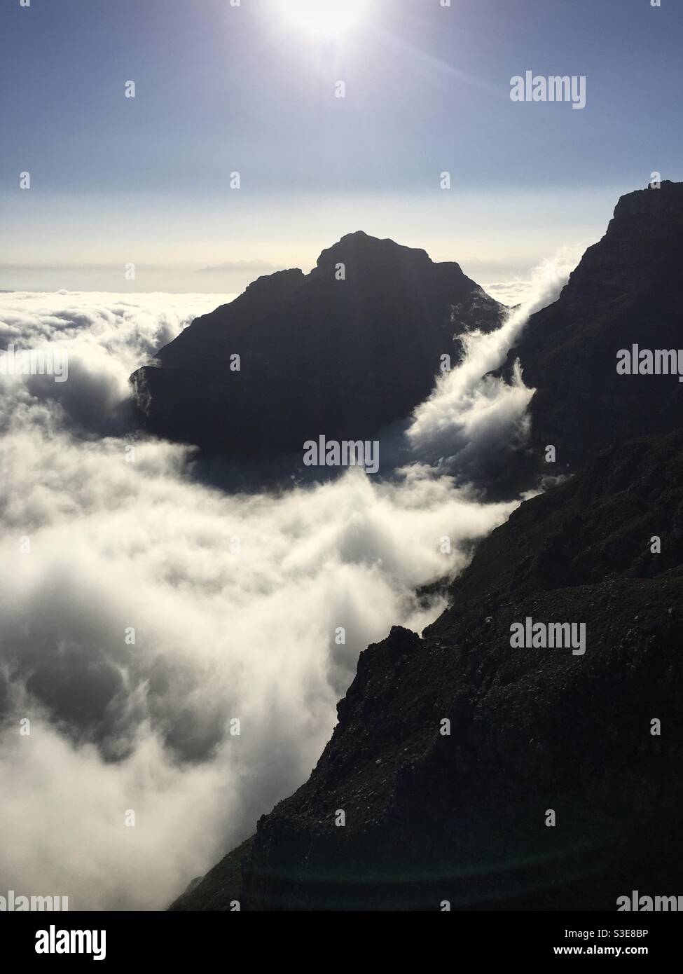 Low cloud surrounding mountain Stock Photo