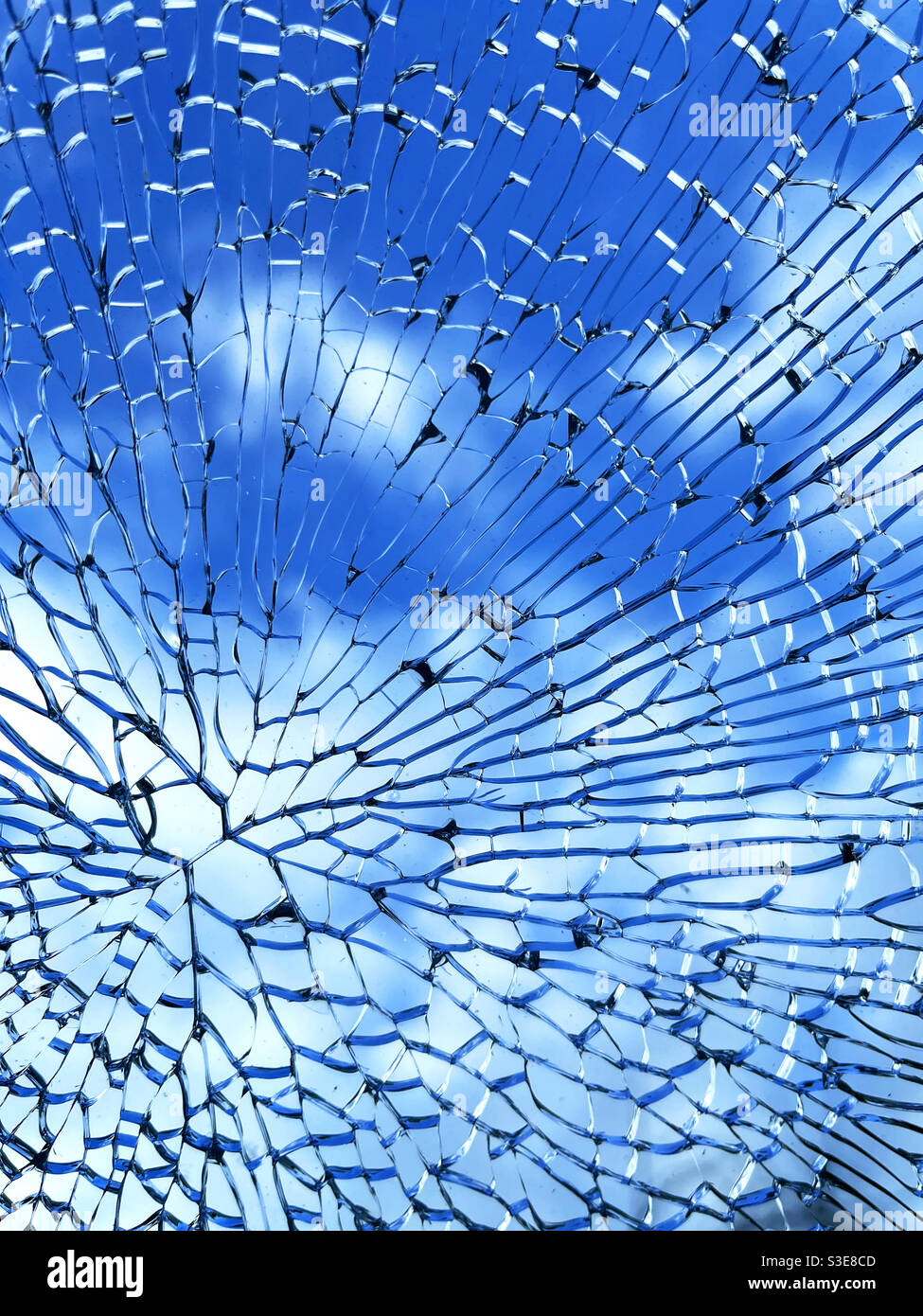 Intricate pattern formed by toughened glass which has shattered - Smartphone Captured Stock Image