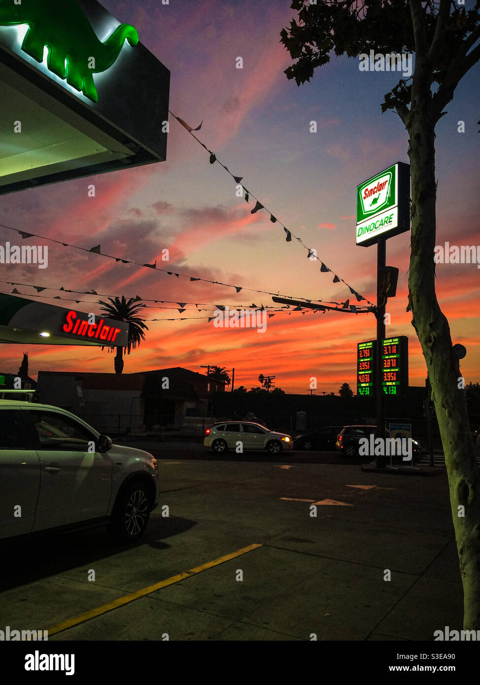 Erie sunset in front of the Sinclair gas station in Highland Park Los