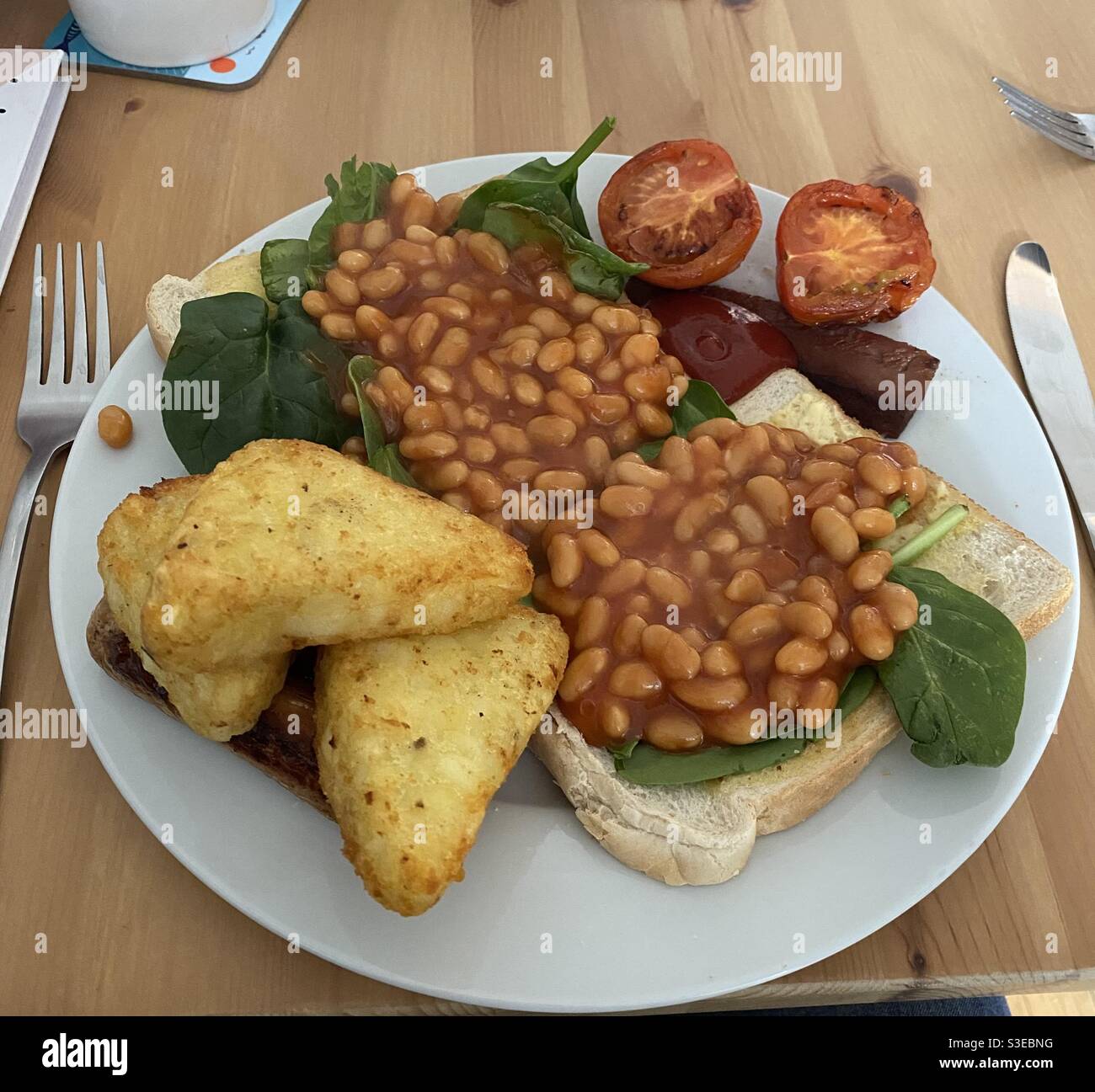 Vegan Breakfast, plant based, baked beans, hash browns, spinach Stock