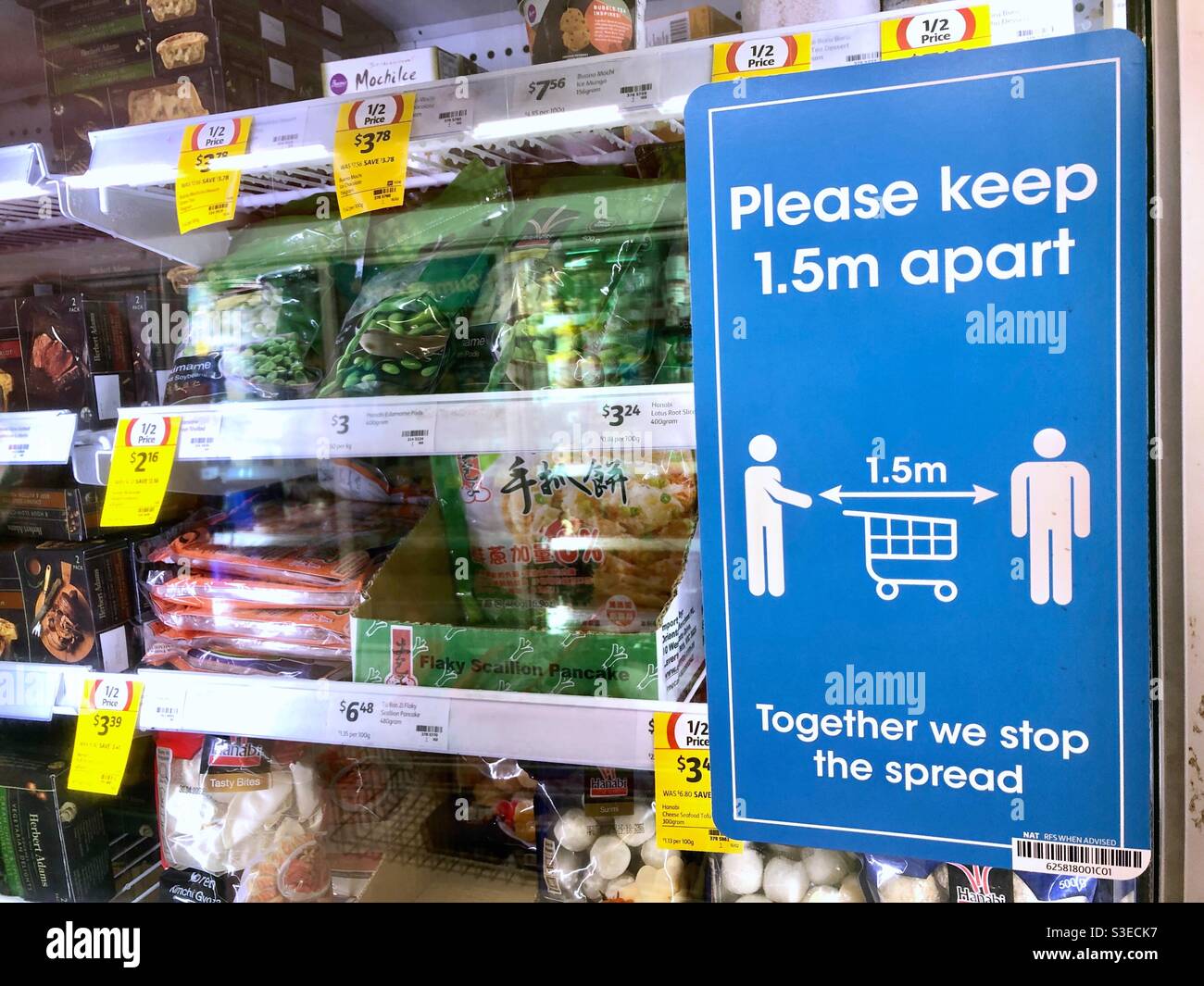 Sign about social distancing for Covid19 in a supermarket in Australia. - Smartphone Captured Stock Image