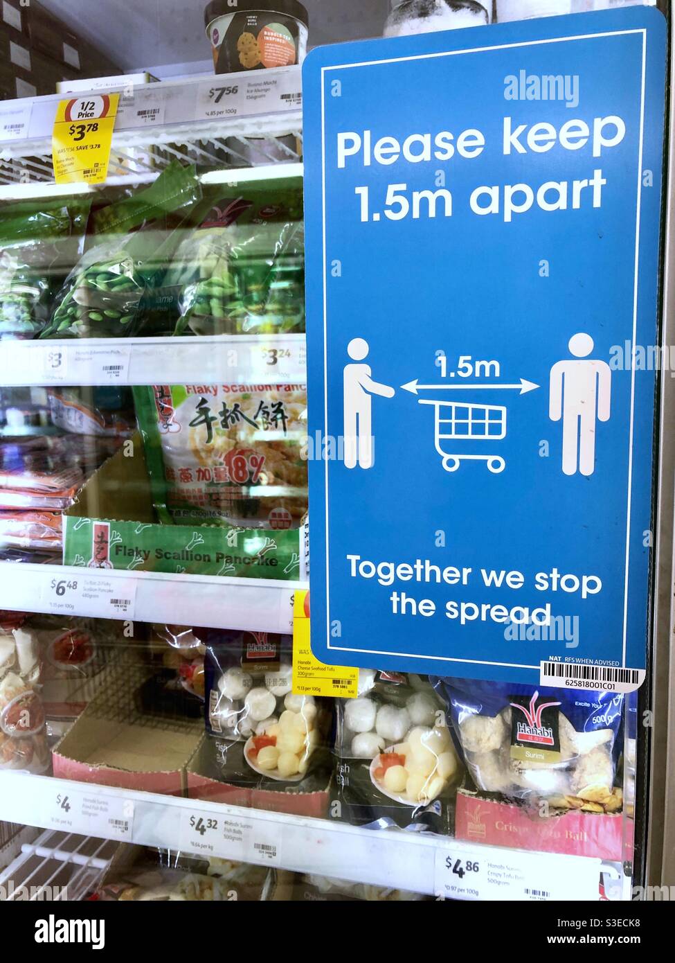 Sign about social distancing for Covid19 in a supermarket in Australia. - Smartphone Captured Stock Image