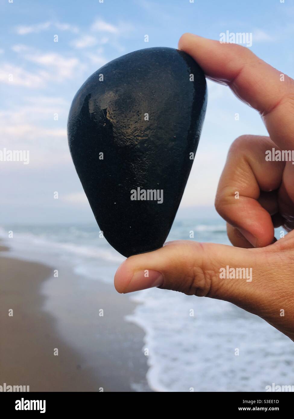 Black rock found on beach Stock Photo Alamy