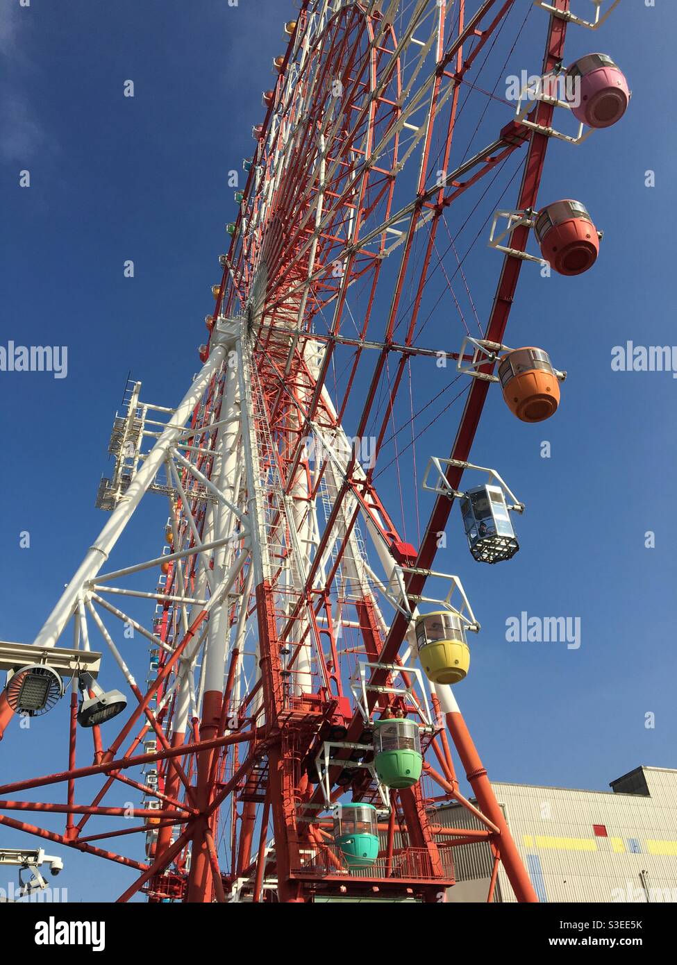 Ferris wheel in clear blue sky Stock Photo