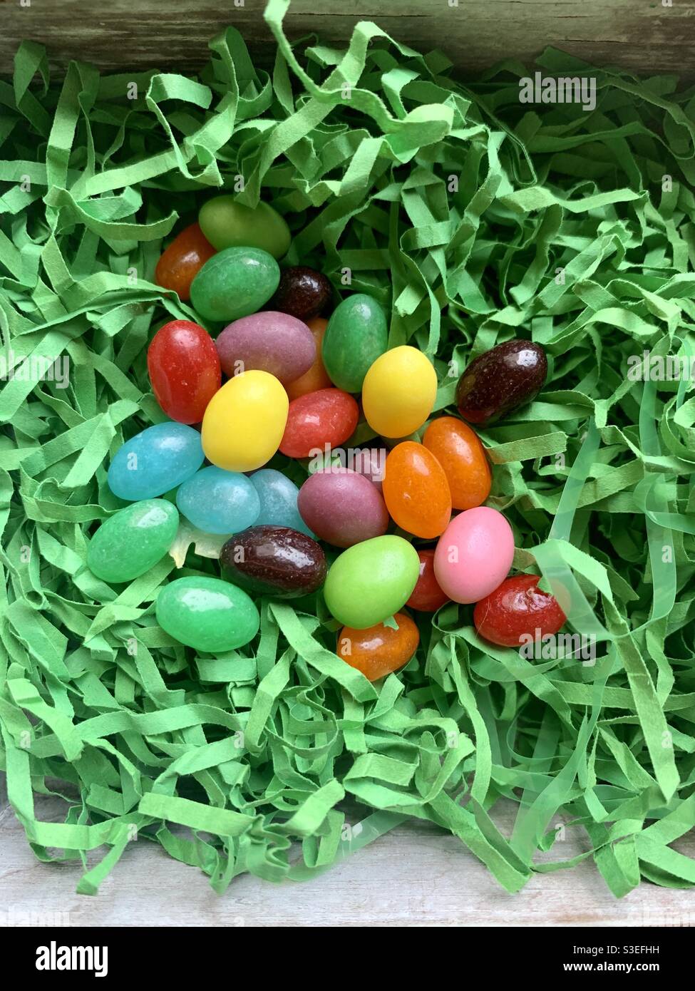 Jellybeans in green Easter grass Stock Photo