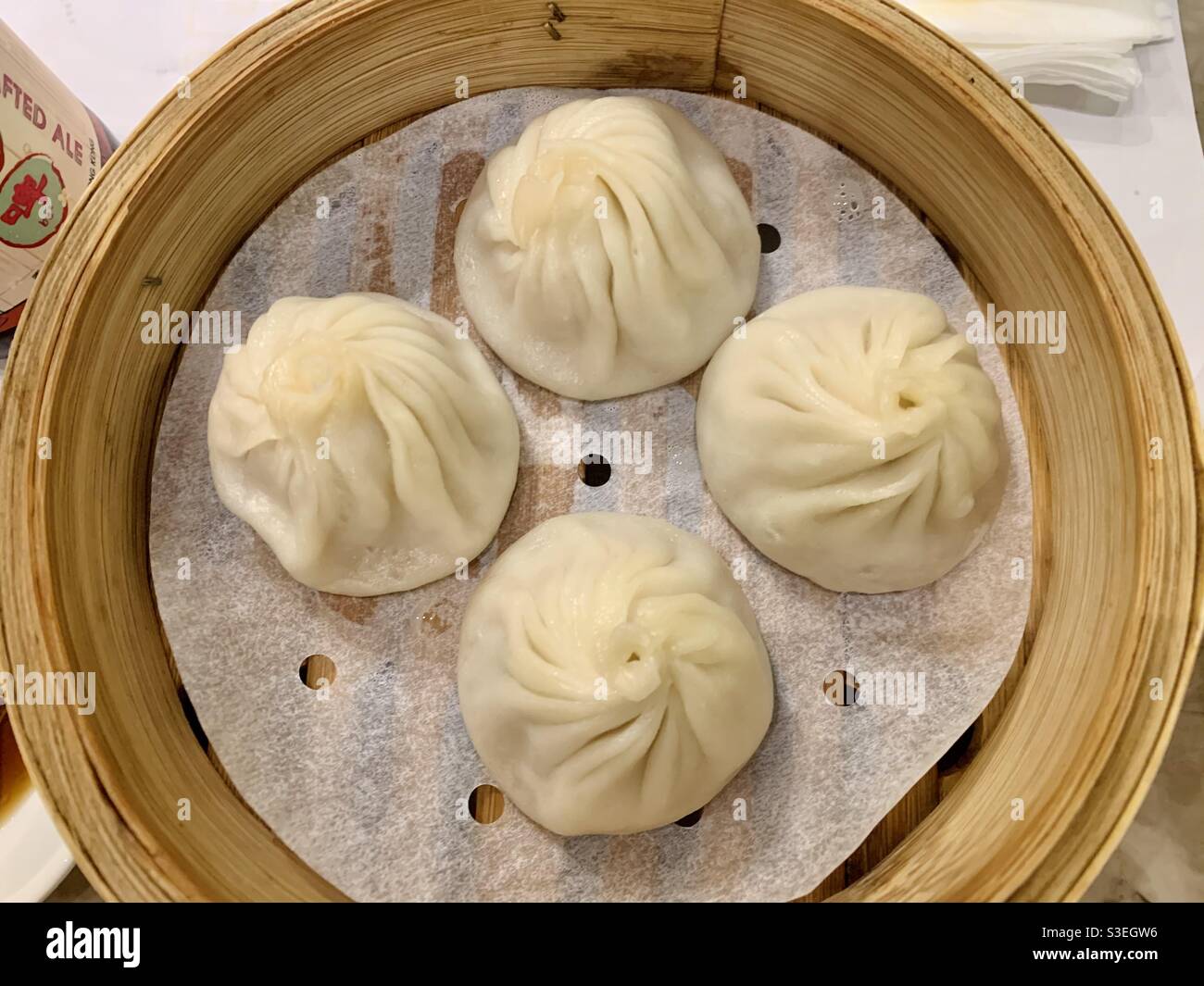 A bamboo basket of steamed Xiaolongbao. Stock Photo